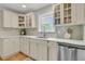 Kitchen featuring white cabinets, marble countertops, tile backsplash and stainless steel appliances at 1023 Shelley Rd, Charleston, SC 29407