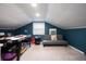 Finished attic space with seating, games, and lighting offers versatility as a playroom or relaxation zone at 103 Winston Way, Goose Creek, SC 29445