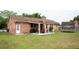 Expansive backyard featuring a covered patio, lush lawn, and ample space for outdoor activities and entertaining at 103 Winston Way, Goose Creek, SC 29445