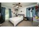 Serene bedroom features a comfortable bed, natural light, and personal touches, creating a cozy and inviting space at 103 Winston Way, Goose Creek, SC 29445