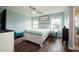 Bright bedroom with wood floors, featuring ample natural light and a ceiling fan at 103 Winston Way, Goose Creek, SC 29445