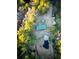 An aerial view of the property with a pond and tree-lined boundary at 107 Bessie Ln, Bonneau, SC 29431