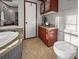 Bathroom boasts dark wood cabinets and drawers, and a deep soaking tub at 107 Bessie Ln, Bonneau, SC 29431