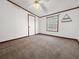 Bedroom featuring neutral colored carpet, natural lighting, and white trim at 107 Bessie Ln, Bonneau, SC 29431