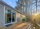 Enjoy the outdoor living space with a wooden deck and a sliding glass door for easy access to inside at 107 Bessie Ln, Bonneau, SC 29431
