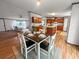View of dining area and kitchen with ample cabinet space and natural light at 107 Bessie Ln, Bonneau, SC 29431