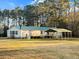 This beautiful home includes a metal carport, a large yard, and a back deck perfect for enjoying the outdoors at 107 Bessie Ln, Bonneau, SC 29431