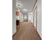 Long hallway with brown carpeting, leading to bedrooms and featuring a built-in desk area at 107 Bessie Ln, Bonneau, SC 29431