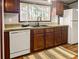 Well-equipped kitchen area featuring wood cabinetry, double sink, and ample counter space at 107 Bessie Ln, Bonneau, SC 29431