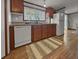 Well-lit kitchen featuring wood cabinets, modern appliances, and a window with a view at 107 Bessie Ln, Bonneau, SC 29431