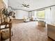 Spacious living room featuring neutral tones, plush carpet, and bright, natural light at 107 Bessie Ln, Bonneau, SC 29431