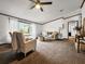 Cozy living area with plush seating, large window, and warm, inviting decor at 107 Bessie Ln, Bonneau, SC 29431