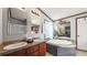 Bright bathroom featuring a tub, shower, double sinks, and generous counter space at 107 Bessie Ln, Bonneau, SC 29431