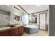 Bright bathroom featuring a tub, shower, double sinks, and generous counter space at 107 Bessie Ln, Bonneau, SC 29431