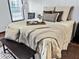 This is a close up shot of the plush bed and stylish decor in the main bedroom at 107 Bessie Ln, Bonneau, SC 29431
