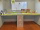 Functional office space featuring a long, bright green table and ample storage solutions at 107 Bessie Ln, Bonneau, SC 29431