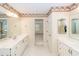 Primary bathroom offers double sinks, tile flooring, and separate vanity at 1100 Cass Dr, Moncks Corner, SC 29461
