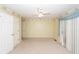 Bedroom with carpeted floor, ceiling fan, and sliding doors to patio at 1100 Cass Dr, Moncks Corner, SC 29461