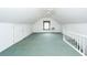 Upstairs bonus room features an ornate window and ceiling fan at 1100 Cass Dr, Moncks Corner, SC 29461