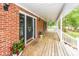 Inviting front porch with ample space, decorative plants, and a ceiling fan for outdoor comfort at 1100 Cass Dr, Moncks Corner, SC 29461