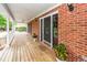 Detailed view of the cozy front porch, showcasing the entrance door and comfortable outdoor space at 1100 Cass Dr, Moncks Corner, SC 29461