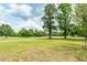 Picturesque view of the golf course with mature trees shading the manicured green at 1100 Cass Dr, Moncks Corner, SC 29461