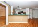 Well-lit kitchen featuring a breakfast bar and seamless flow to adjacent areas, ideal for entertaining at 1100 Cass Dr, Moncks Corner, SC 29461