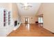 Open-concept living room with hardwood floors, a fireplace, built-in cabinets, and ample natural light at 1100 Cass Dr, Moncks Corner, SC 29461