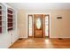 Foyer featuring a decorative wood front door with side lights and hardwood floors at 1100 Cass Dr, Moncks Corner, SC 29461