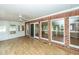 Spacious sunroom featuring brick accents, sliding glass doors, and natural light at 1100 Cass Dr, Moncks Corner, SC 29461