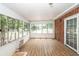 Sunroom featuring multiple windows offering views of the surrounding landscape at 1100 Cass Dr, Moncks Corner, SC 29461