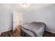 A simple bedroom with hardwood floors and a door leading to the hallway at 115 Myers Rd, Summerville, SC 29486