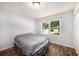 Cozy bedroom with hardwood floors and natural light streaming through the large window at 115 Myers Rd, Summerville, SC 29486