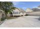 Rear elevation of a home featuring backyard, patio and fenced yard at 115 S Ainsdale Dr, Charleston, SC 29414