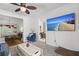 Relaxing living area features a comfortable blue chair and a large flat-screen TV for entertainment at 115 S Ainsdale Dr, Charleston, SC 29414