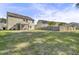 Large grassy backyard featuring a screened porch and wooden fence, perfect for outdoor activities and privacy at 118 Beacon Falls Ct, Summerville, SC 29486