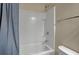 Bathroom with bathtub, shower, white tile and blue shower curtain at 118 Beacon Falls Ct, Summerville, SC 29486