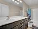 A bathroom with a double sink vanity, shower with curtain, toilet and tile flooring at 118 Beacon Falls Ct, Summerville, SC 29486