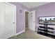 Well-lit room featuring white doors, a lavender wall, and a TV at 118 Beacon Falls Ct, Summerville, SC 29486
