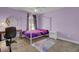 Bright bedroom with desk, a purple four poster bed, and a neutral carpet at 118 Beacon Falls Ct, Summerville, SC 29486