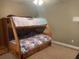 A bedroom featuring a bunk bed, drawers, carpeted flooring and neutral paint at 118 Beacon Falls Ct, Summerville, SC 29486