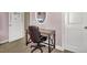 A bedroom desk with an office chair, and a view of the street, through an oval mirror at 118 Beacon Falls Ct, Summerville, SC 29486