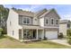 Attractive two-story home with a stone-accented front, covered porch, and well-maintained lawn at 118 Beacon Falls Ct, Summerville, SC 29486