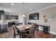 Eat-in kitchen features dark cabinetry, granite countertops, stainless appliances and hardwood floors at 118 Beacon Falls Ct, Summerville, SC 29486