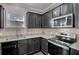 Kitchen with stainless steel appliances, granite countertops, and dark wood cabinets at 118 Beacon Falls Ct, Summerville, SC 29486