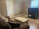 Living room with couch, decorative ottoman, television and closet at 118 Beacon Falls Ct, Summerville, SC 29486