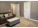Living room with couch, decorative ottoman, and multiple closets at 118 Beacon Falls Ct, Summerville, SC 29486