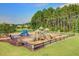Community playground with various play structures, swings, and slides, providing a fun and safe environment for  at 118 Beacon Falls Ct, Summerville, SC 29486