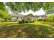 Lush backyard showcasing the home's screened porch and outdoor space at 1226 Forestwood Dr, Charleston, SC 29407