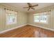 Bedroom with hardwood floors and neutral decor with two windows allowing for natural light at 1226 Forestwood Dr, Charleston, SC 29407